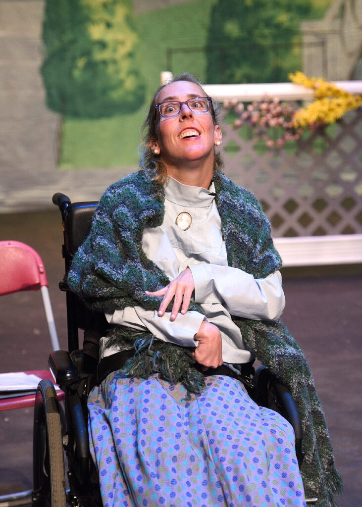 Actress in wheelchair smiling